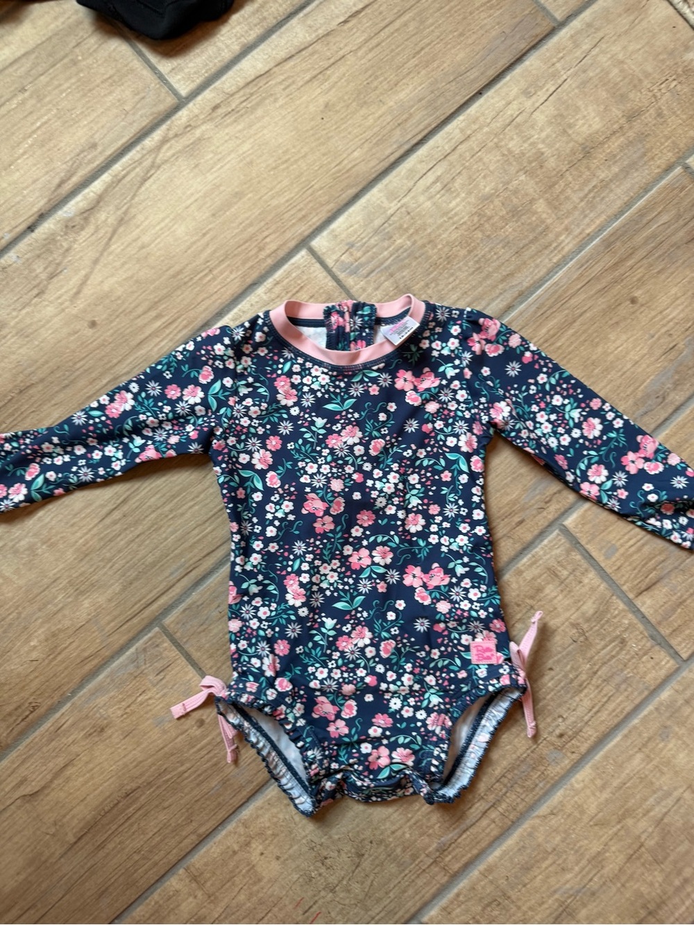 Ruffle Butts Navy Floral Long-Sleeve Rashguard Swimsuit with Pink Trim